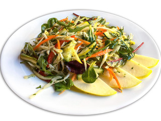 Salad with apples and vegetables on a plate