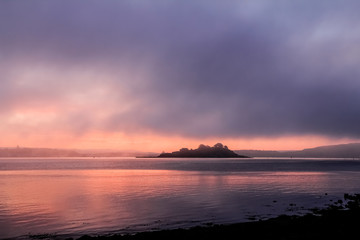 Naklejka na ściany i meble Sunrise over Drakes Island, with fog clearing in Plymouth Sound, Devon.