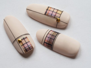 Stylish design on tips. Macro texture of nails.