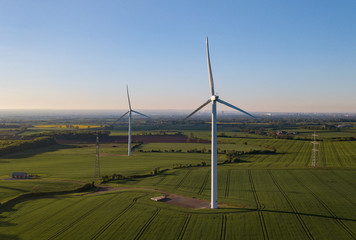 photos of wind turbines providing renewable green energy in england in the country side