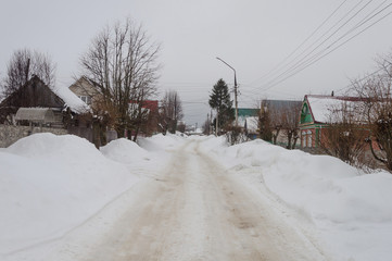 Snowy street in russian village