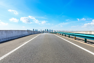 Straight asphalt highway passing through the city above in Shanghai