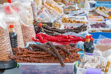 Counter with various tasty sweets and nuts in the bazaar