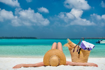 Woman lying down on beach