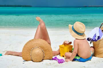 Woman with three year old boy on beach