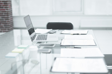 laptop and clipboard on the desktop in the office.photo with copy space