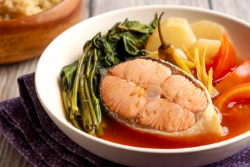 Salmon in sour Miso broth. Very tasty dish from Philippines. Sinigang na Salmon.