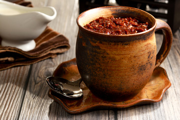 Delicious Cocoa Rice Porridge on the table. Filipino cuisine. Champorado.