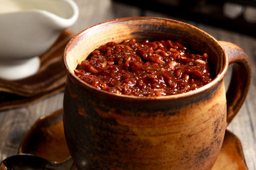 Delicious Cocoa Rice Porridge on the table. Filipino cuisine. Champorado.