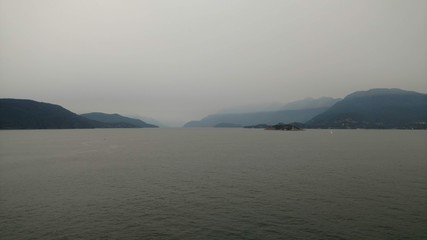 Dreary skyline along the inside passage in Alaska. Heavy clouds and fog as a storm rolls in