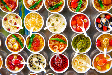 The taste of Vietnam. Food in small bowls at the market.