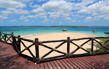 wooden fence on sea shore