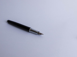 Black metal business fountain pen on white background
