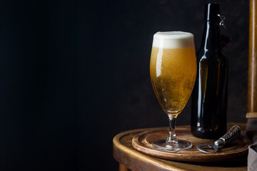 Glass beer on dark background with copy space