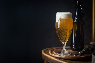 Glass beer on dark background with copy space