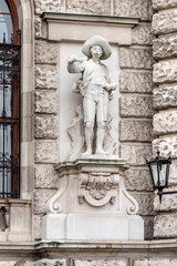 Fototapeta na wymiar Austria, Vienna, Heldenplatz: Big statue sculpture at the Neue Burg exterior wall facade as part of the famous Hofburg Palace in the city center of the Austrian capital - concept architecture art