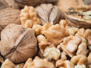 Shelled walnuts in close-up on a wooden tray
