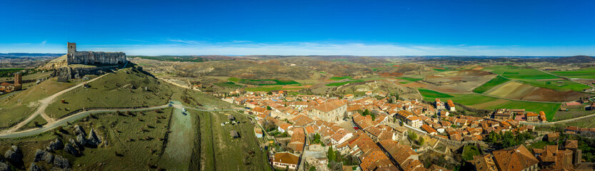 Fototapeta na wymiar Atienza aerial panorama with blue sky of medieval ruined castle and town with city walls in Castille and Leon Spain