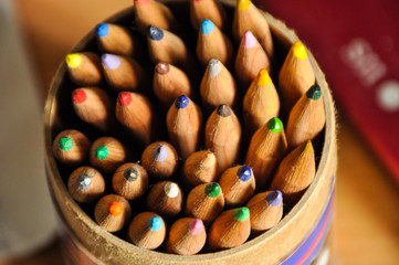 Colored pencils in a paper cylinder