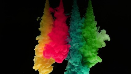 Super slowmotion shot of colorful inks in water. Shot with high speed camera at 4K.