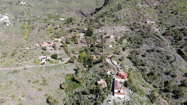 Flying over the Masca gorge Tenerife. Old village in the mountains. Famous tourist spot in the Masca gorge surrounded by volcanic mountains, beautiful nature