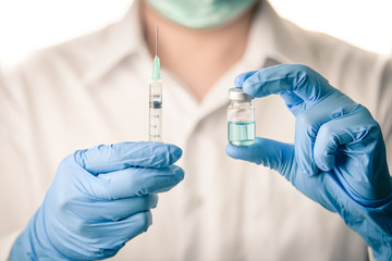 Doctor, nurse, scientist, man or women holding flu, hpv, rabies, mumps, measles, polio, or...