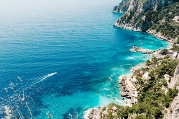Fototapeta na wymiar Capri coast view. Beautiful island beach with rocks