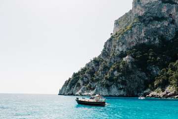 Capri coast view. Beautiful island beach with rocks