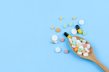 Medicine, pill, capsule or drug tablet on medical blue background