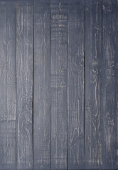 Dark wooden background made of a narrow board.