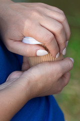 A paper cup of coffee in the hand