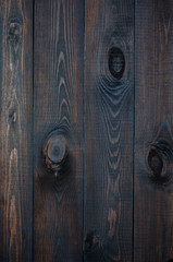 Fototapeta na wymiar Dark wooden background made of a wide board.