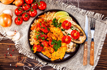 Roasted meat, groats and vegetables