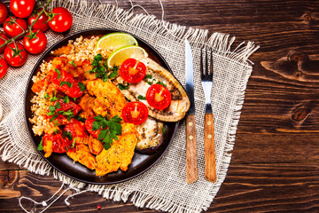 Roasted meat, groats and vegetables