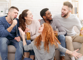 Students having party, singing together at home