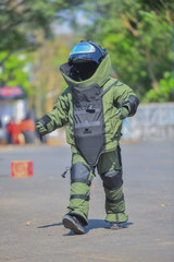 Explosive Ordnance Disposal's officer in The explosive ordnance disposal suit walking on the road to security check 