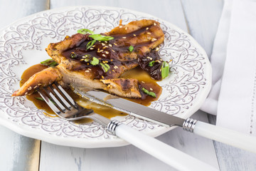 Homemade roasted chicken breast with apricot jam.