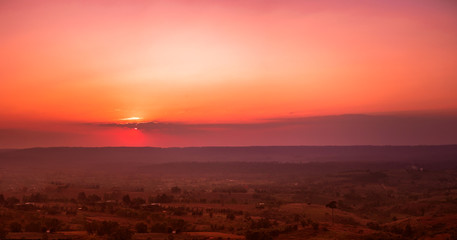 Travel and landscape in summer concept from panorama view of beautiful sky with sunset on layer of mountain and cloudy background