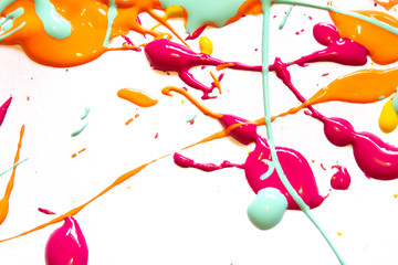 Orange, PInk and Blue Paint Splatters on White Background