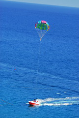 Fly a parachute over the sea, paraglider flying over the sea