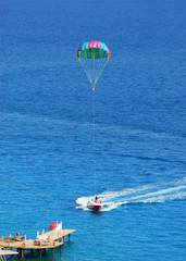 Fly a parachute over the sea, paraglider flying over the sea