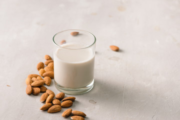 Almond milk in glass. Organic healthy snack vegan vegetarian