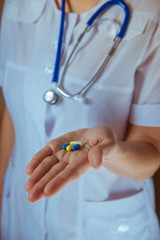 hands of doctor with pills closeup