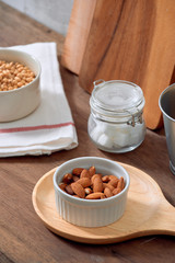 Kitchen still life with nuts and utensils