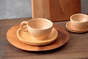 Kitchen tools for cooking on a wooden table on the background of a concrete wall. Copy space