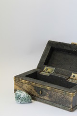 opened old chest box and rock