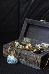 old chest box with jewelry and rock 