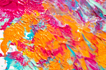 Pink Blue and Orange Paint Splatters on White Background