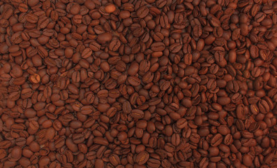 Roasted coffee beans background. Aroma caffeine drink ingredient for coffee beverage. Close-up calm tone brown texture.