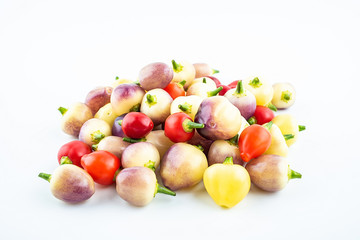 Bunch of fresh colorful peppers on white background
